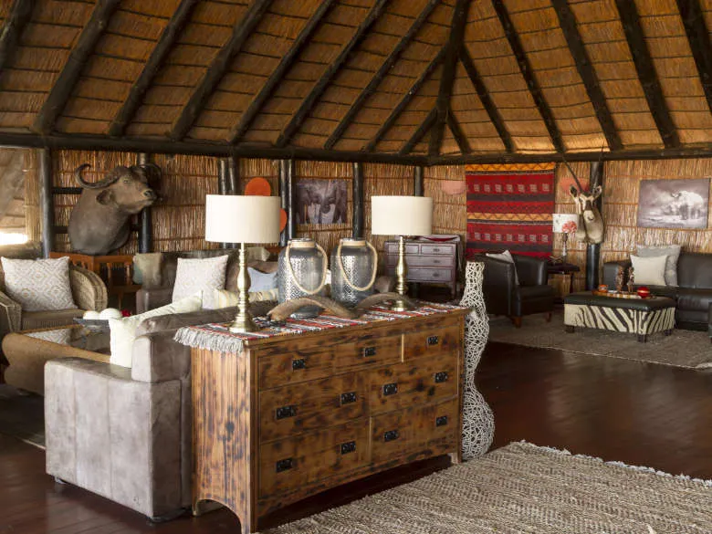 Wooden interior with rustic furniture animal head mount and woven decor