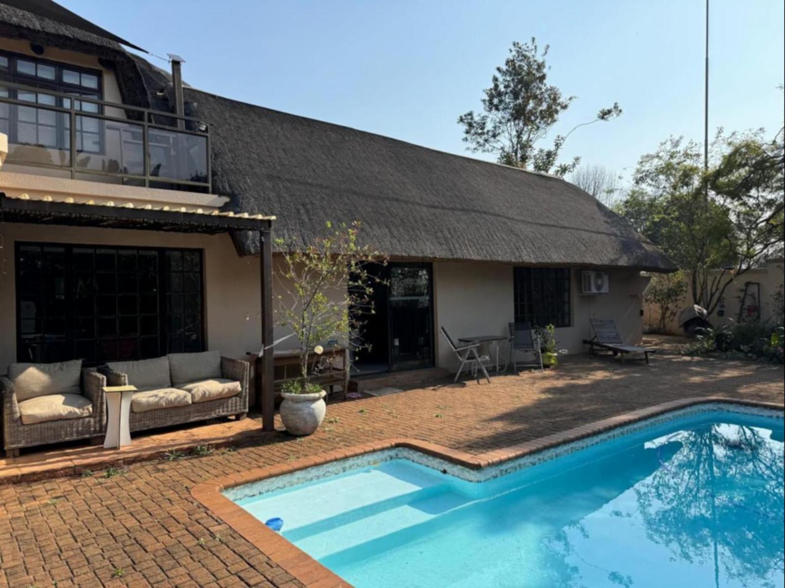 Rose Thatch House