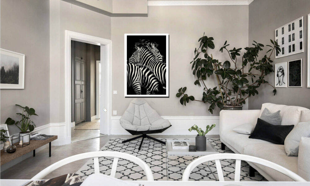 Modern living room with zebra artwork, plants, and stylish furniture.