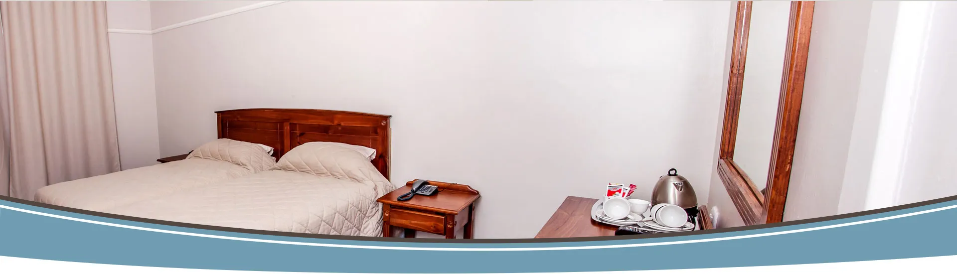 Simple bedroom with wooden bed nightstand and mirror minimal decor