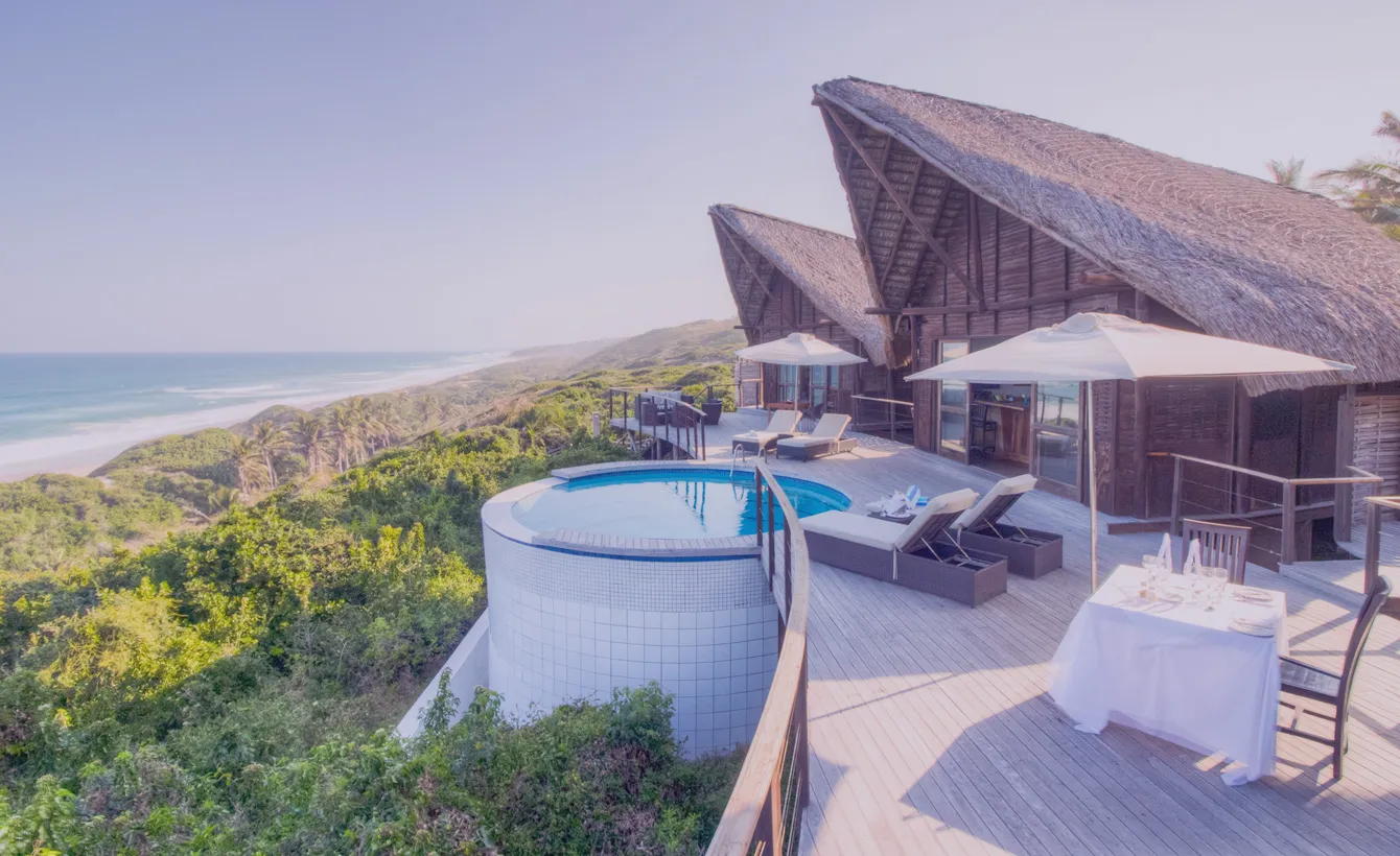 Beachfront lodge with pool deck and ocean view