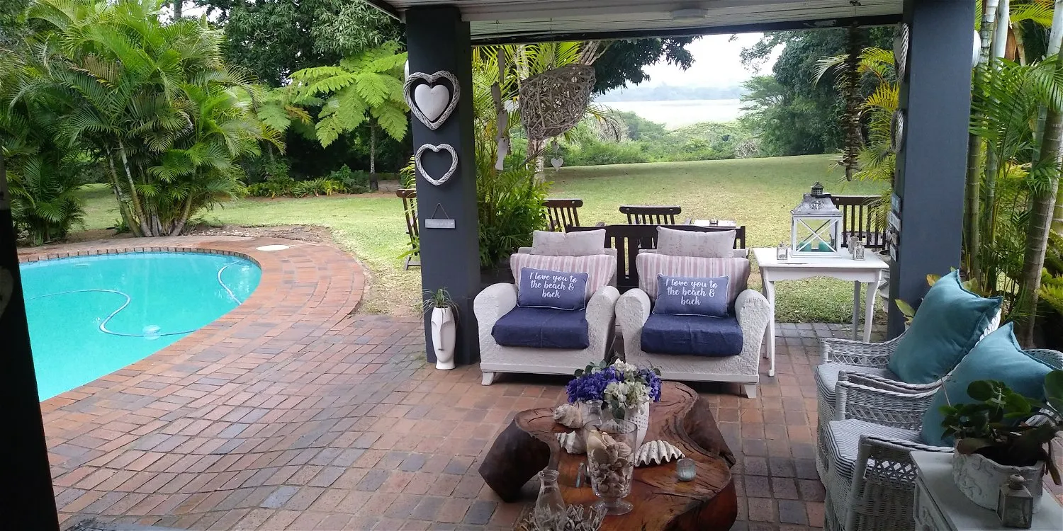 Patio with pool seating area and garden view