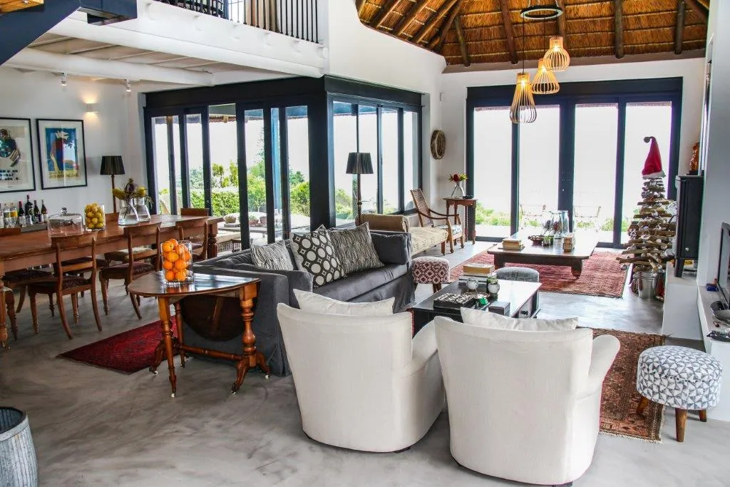 Open living area with dining table sofas and Christmas decorations