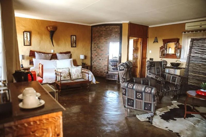 Cozy bedroom with rustic decor wooden furniture and a cowhide rug