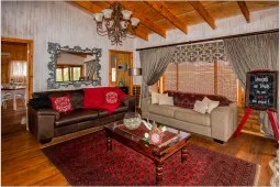 Cozy living room with wooden ceiling two sofas and a coffee table