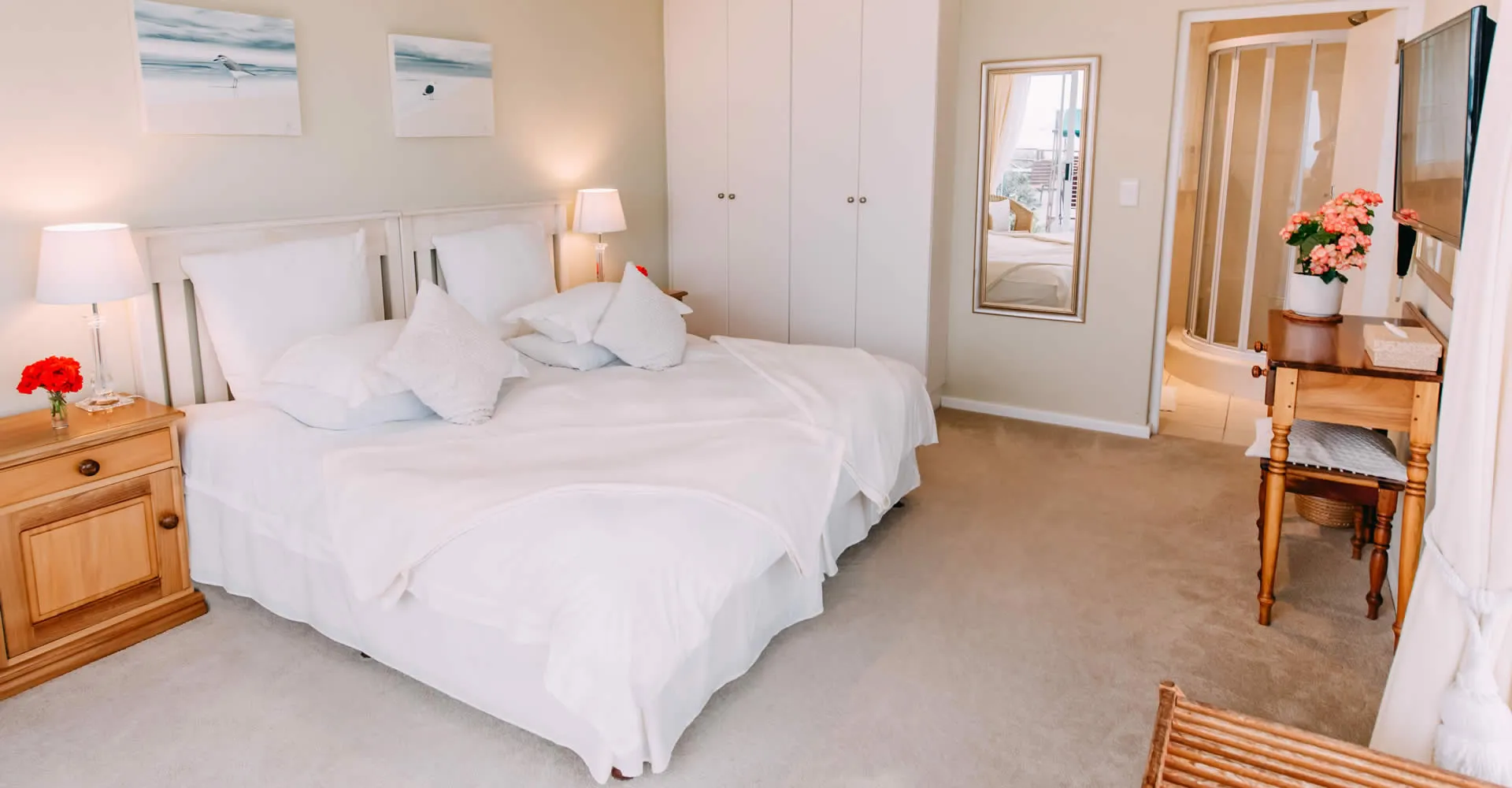 Cozy bedroom with two single beds wooden furniture and a mirror