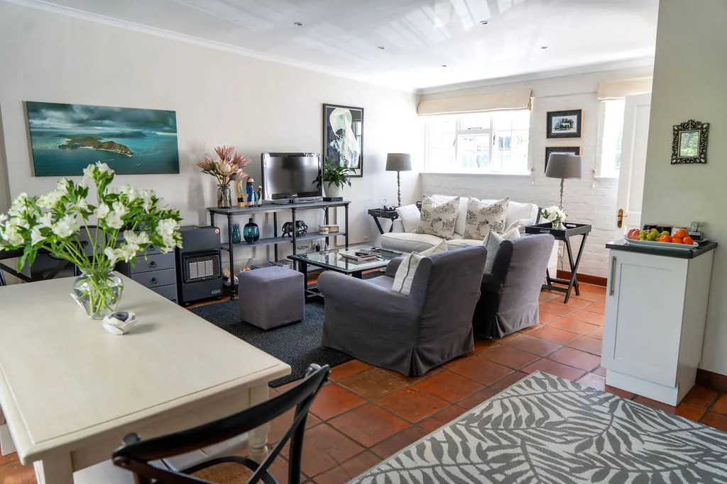 Cozy living room with furniture TV and dining table with flowers