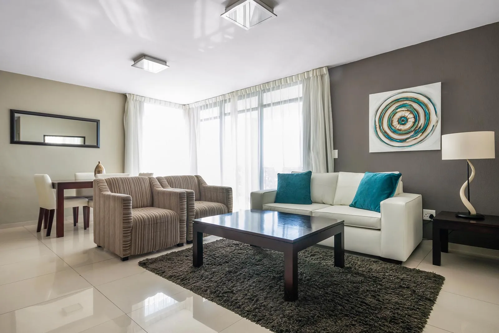 Modern living room with sofas coffee table and large windows