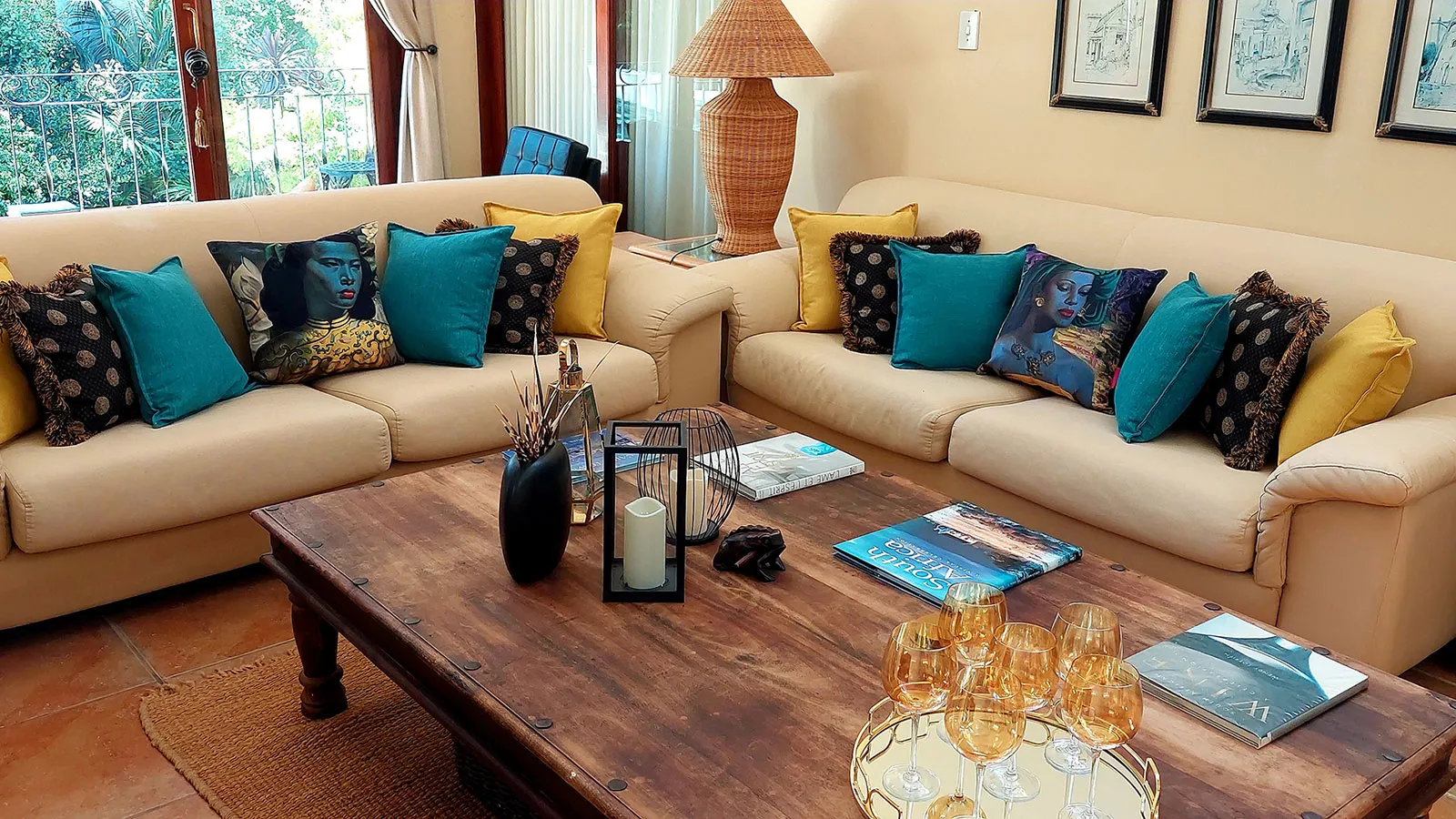 Two beige sofas with colorful cushions in a cozy living room with wooden table