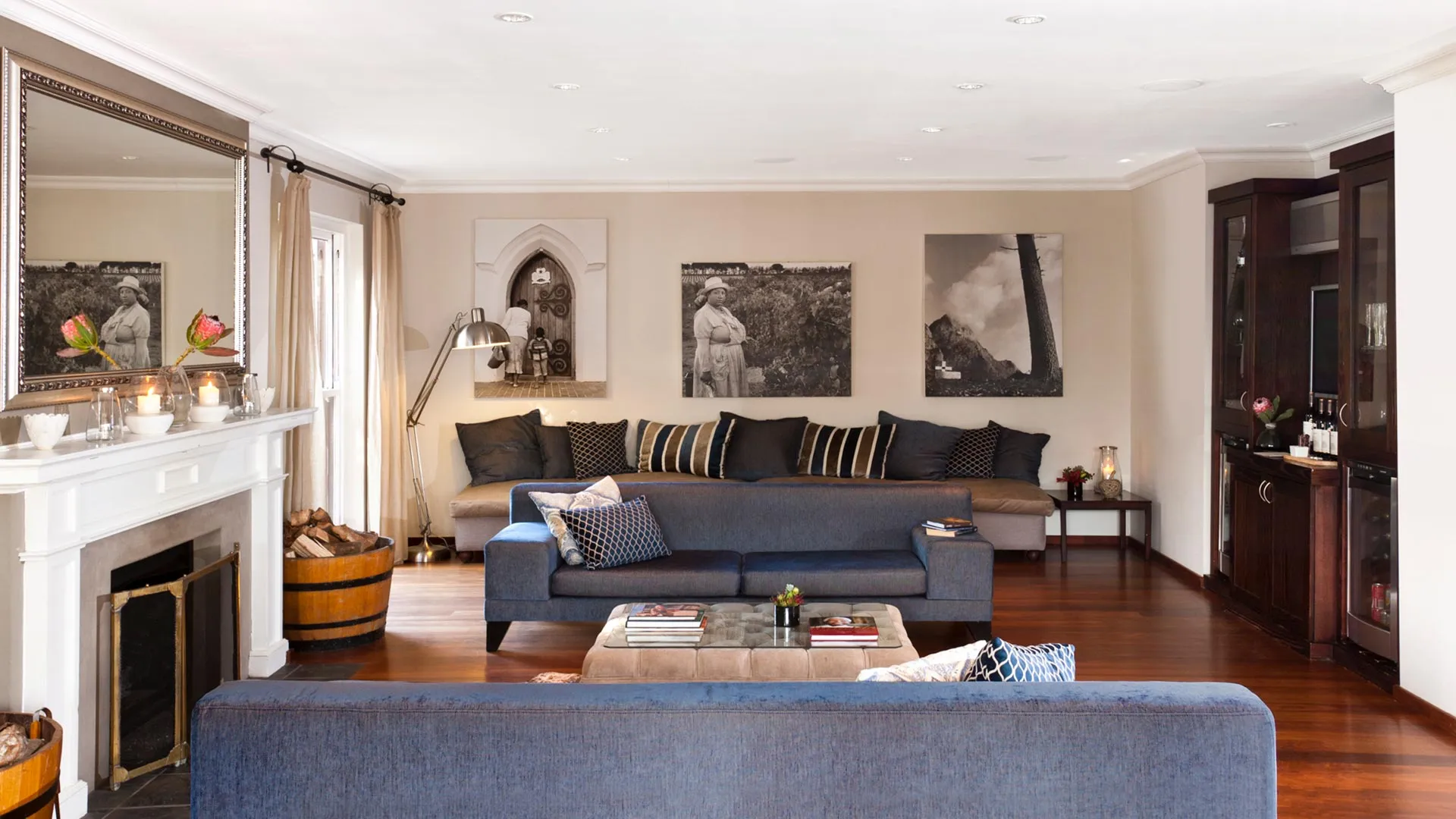 Cozy living room with fireplace sofa coffee table and framed artwork