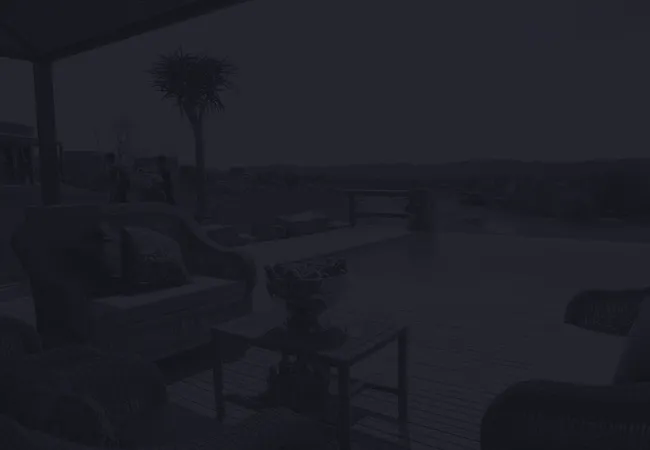 Outdoor seating area with chairs table and a scenic view