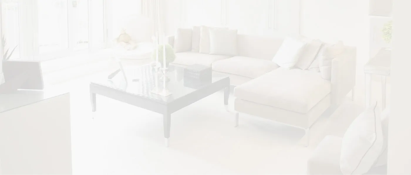 Modern living room with white furniture and large windows