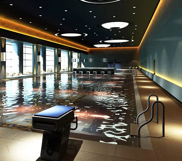 Modern indoor swimming pool with blue lighting and large windows