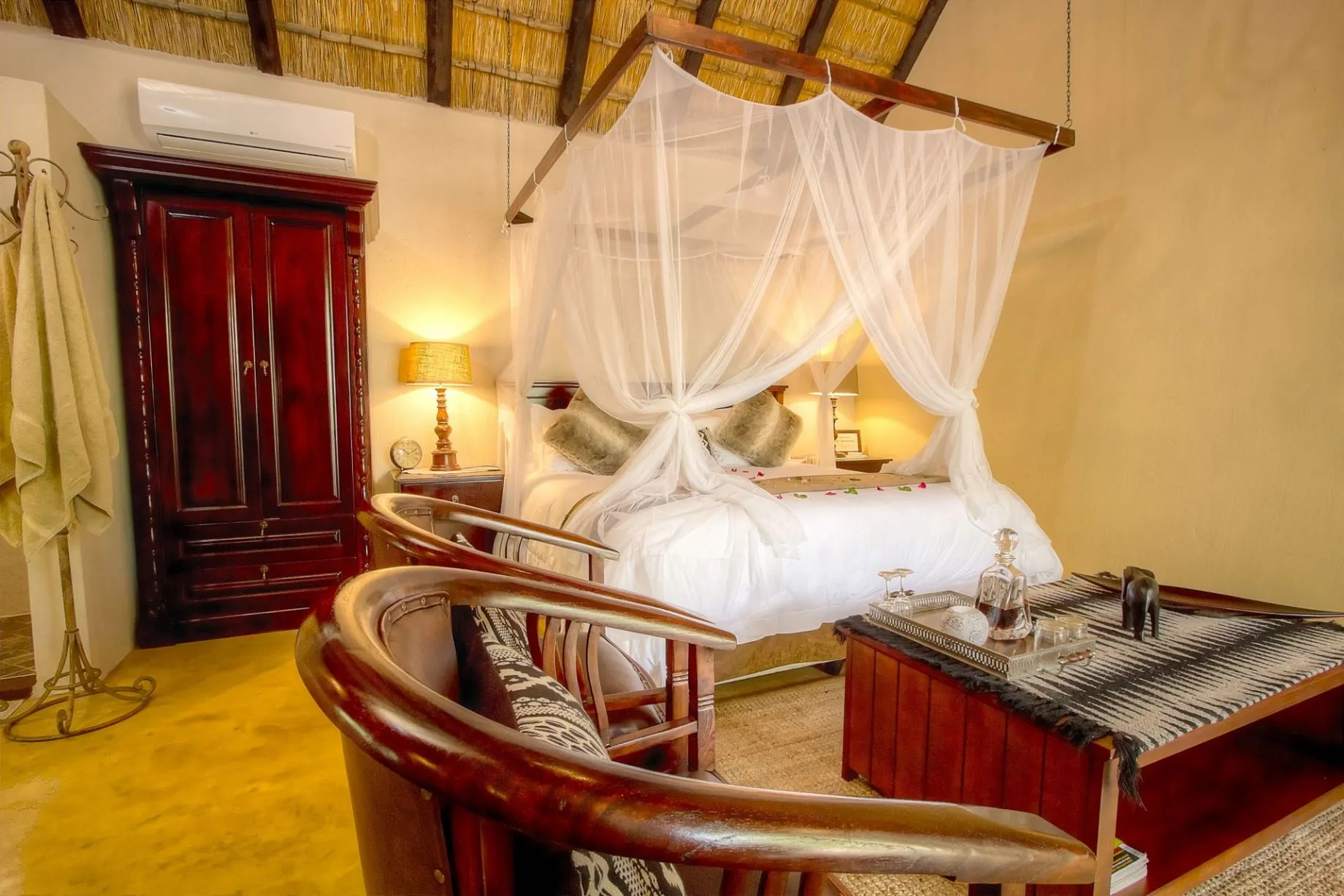 Wooden bedroom with canopy bed wooden furniture and yellow walls