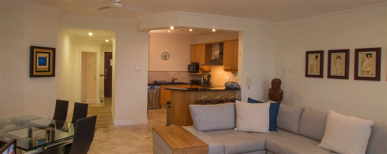 Modern openplan living area with kitchen dining table and sofa