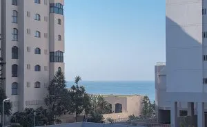 Modern buildings with ocean view clear blue sky