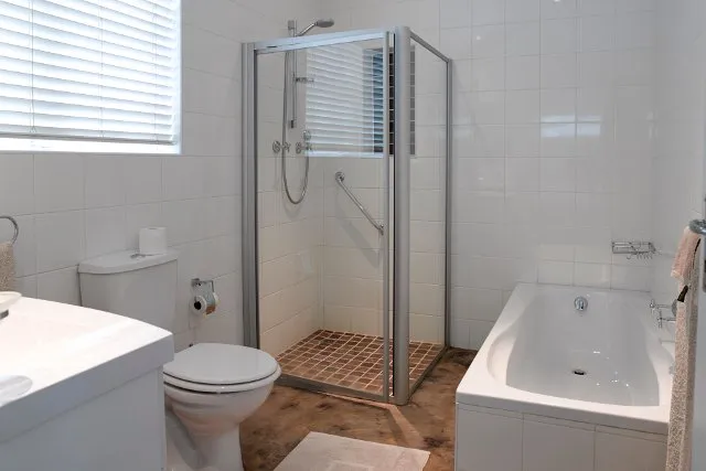 Modern bathroom with shower bathtub toilet and sink
