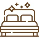 Brown line drawing of a bed with sparkling stars above it