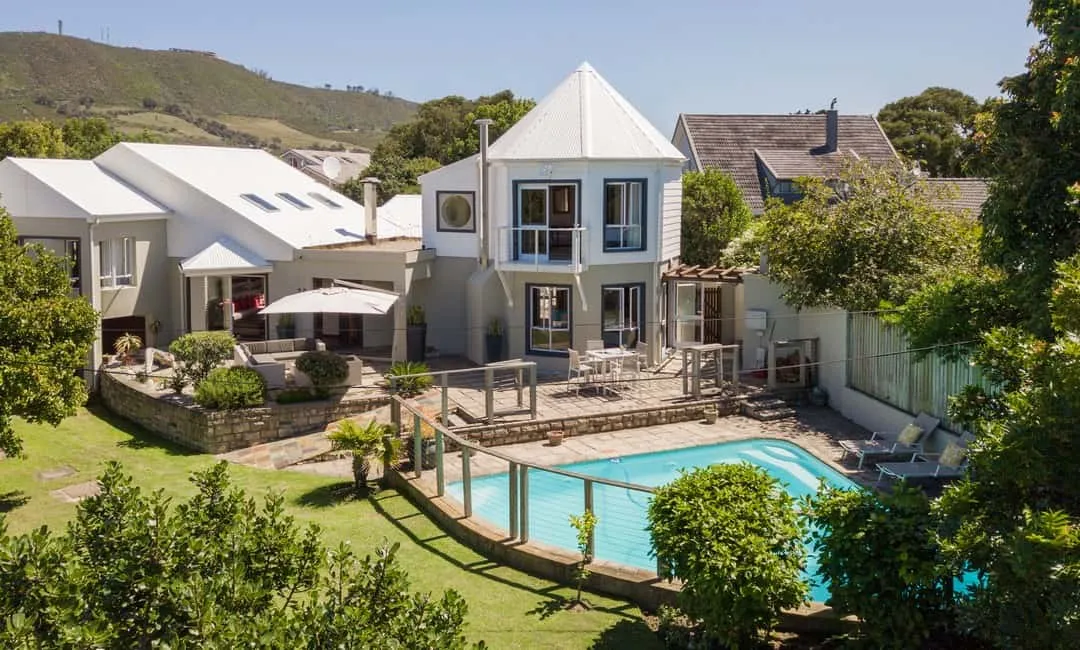 Modern house with pool and garden in a scenic hilly area