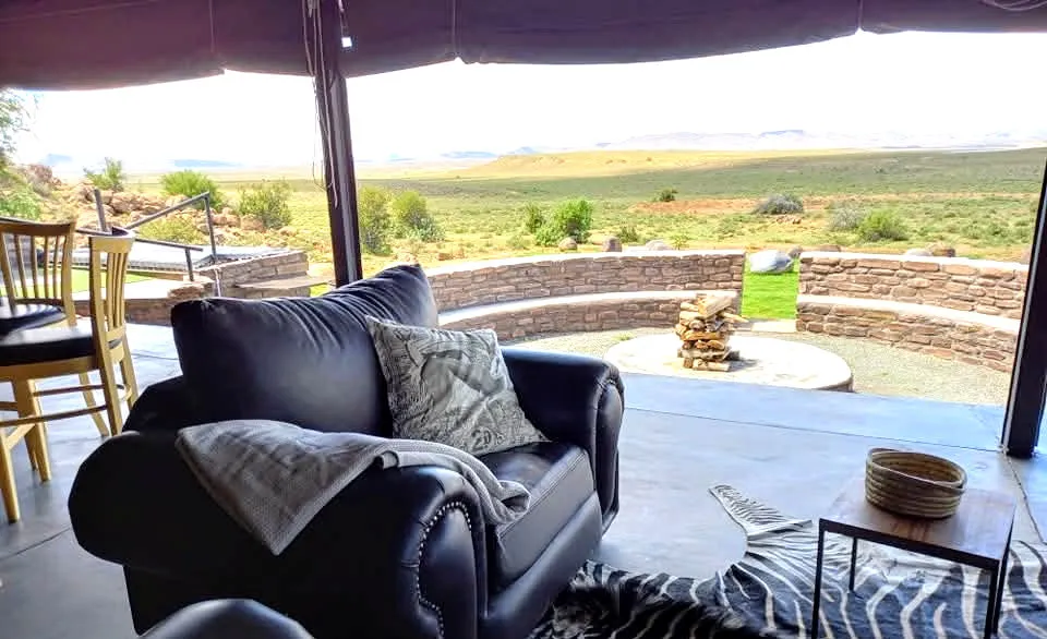 Leather armchair with blanket in outdoor patio with scenic view