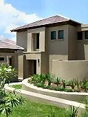 Modern twostory house with garden and clear sky background