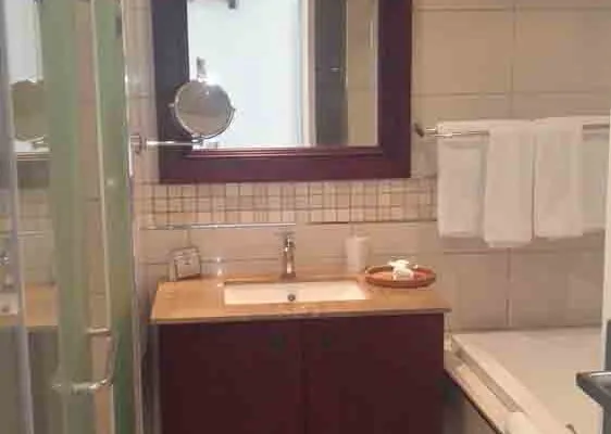 Modern bathroom with sink mirror and towel rack