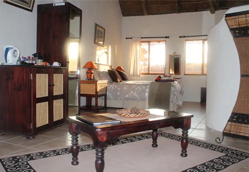 Cozy bedroom with wooden furniture large bed and tiled floor
