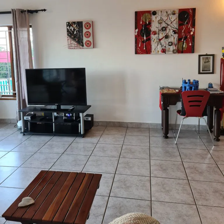 Modern living room with TV desk and abstract wall art