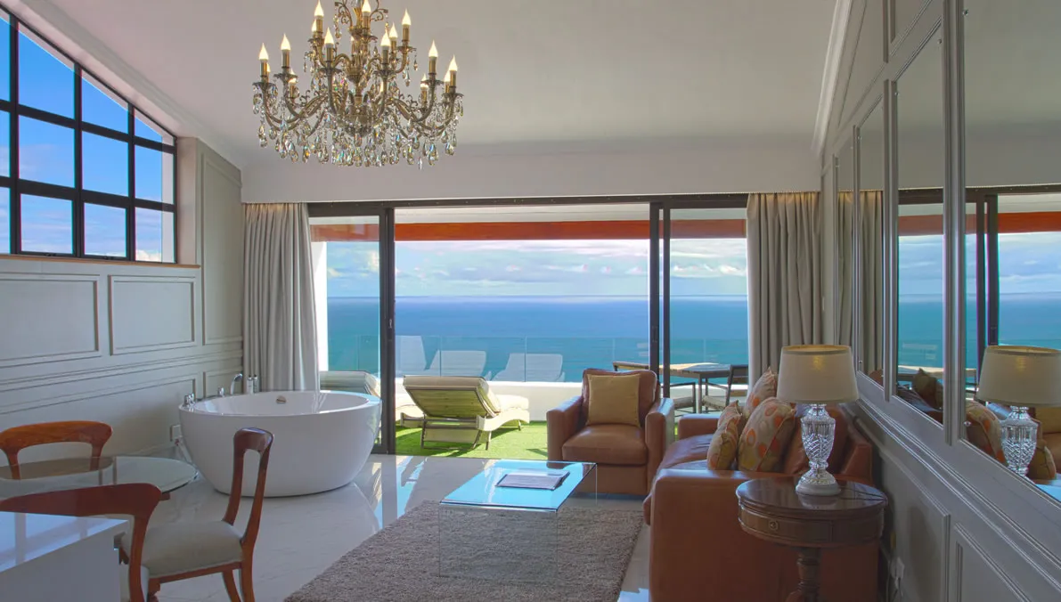 Luxurious room with ocean view chandelier bathtub and elegant furniture