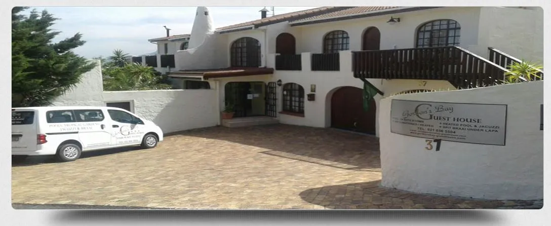 White building with First House sign parked white van tiled driveway
