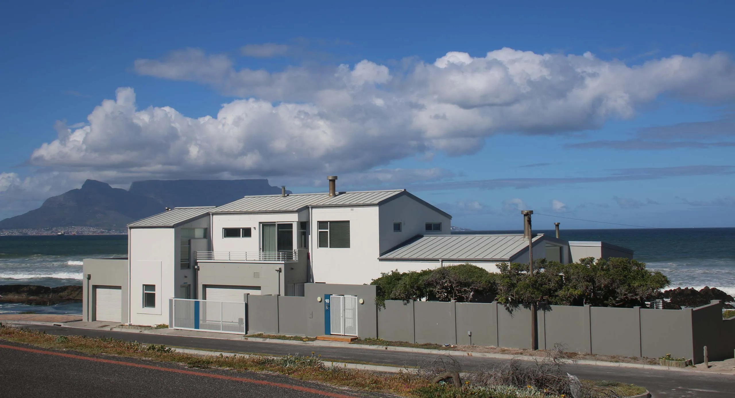 Modern house by the ocean with Table Mountain in the background