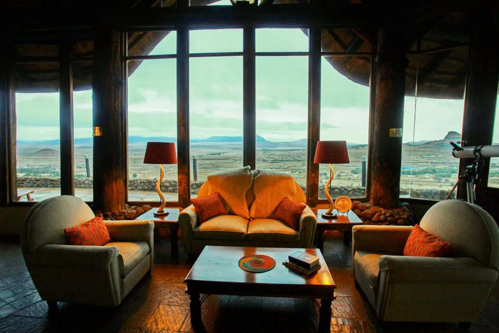 Cozy living room with large windows overlooking a scenic landscape