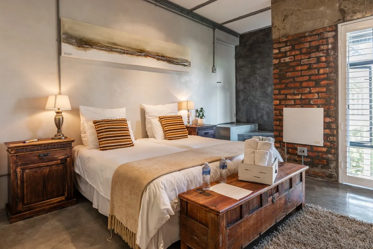 Cozy bedroom with two beds wooden furniture and modern decor