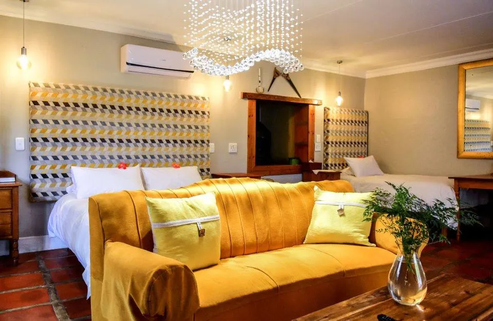 Yellow sofa and bed in a cozy bedroom with modern decor