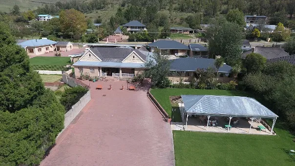 Aerial view of a residential area with houses and a driveway