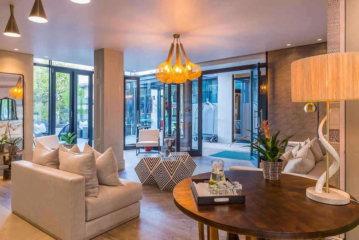 Modern living room with large windows contemporary furniture and warm lighting